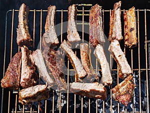 Roasted Juicy spare ribs cooked over the coals on a barbecue. Summer and holiday time