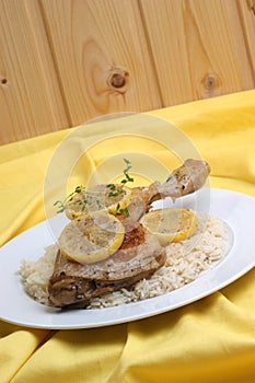 Roasted lemon chicken on some rice