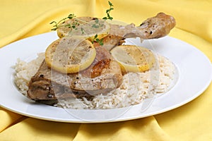 Roasted lemon chicken on some rice