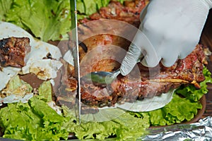 Roasted meat over an open fire, cooked in a special way.Barbecue is prepared of lamb or sheep meat and processed by