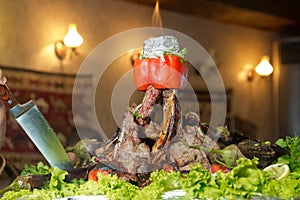 Roasted meat over an open fire, cooked in a special way.Barbecue is prepared of lamb or sheep meat and processed by