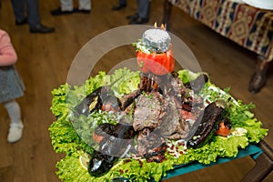 Roasted meat over an open fire, cooked in a special way.Barbecue is prepared of lamb or sheep meat and processed by