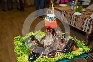 Roasted meat over an open fire, cooked in a special way.Barbecue is prepared of lamb or sheep meat and processed by