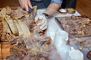 Roasted meat over an open fire, cooked in a special way.Barbecue is prepared of lamb or sheep meat and processed by slasher. Many photo