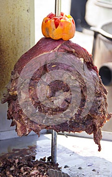 Roasted meat on a spit for making Shawarma