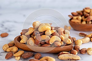 Roasted mixed nuts in wooden bowl