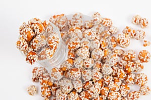 Roasted peanuts coated with sugar and sesame.