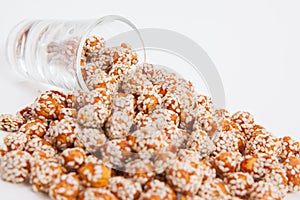 Roasted peanuts coated with sugar and sesame.