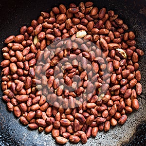 roasted peanuts in an old metal pan