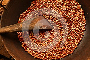 Roasted peanuts with spatula