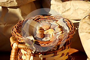 Roasted peeled peanuts in rustic wicker wood basket