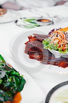 Roasted Peking duck crispy skin with sweet sauce on thin pancake wrap