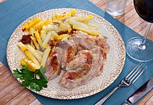 Roasted pettitoes with fried potatoes and fresh greens