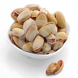 Roasted pistachios in a bowl ,Pistachios, white background