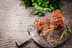 Roasted pork belly with crust and herbs