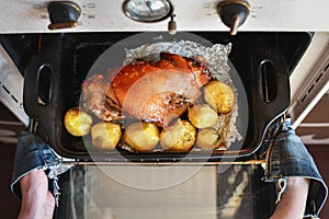 Roasted pork foreshank with potatoes