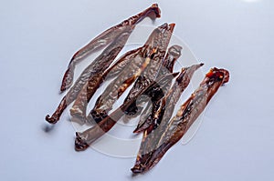 Roasted pork kidneys. Traditional national snack. Shooting overthrow down. Macro. White background.