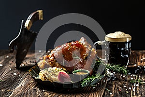 Roasted Pork knuckle with beer and sauerkraut. Oktoberfest menu