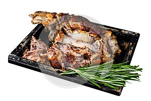 Roasted pork knuckle eisbein meat in a wooden tray with knife. Isolated on white background. Top view.