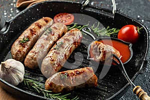 Roasted pork meat sausages on the grill pan. banner, menu, recipe place for text, top view