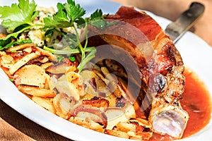 Roasted pork Munich style with fried potatoes