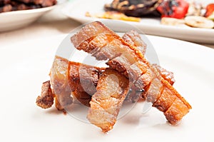 Roasted pork panceta on a plate photo