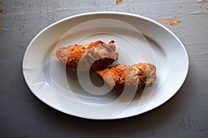 Roasted pork roll stuffed . Meat rolls. white pepper black pepper, spices on old wooden board