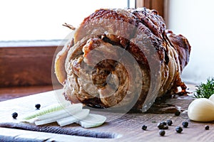 Roasted pork roll stuffed with vegetables and garlic