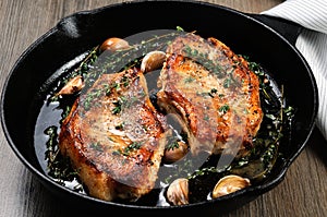 Roasted pork steak in frying pan