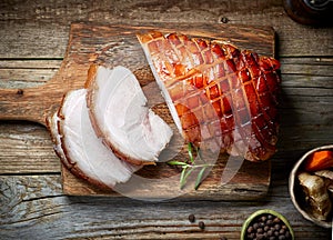 Roasted pork on wooden cutting board
