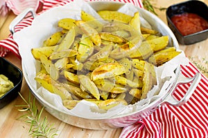 Roasted potato wedges with herbs photo