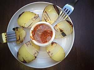 Roasted potatos with red chimichurri sauce