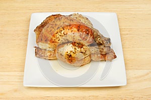 Roasted poussin on a plate photo