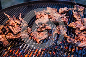 Roasted quail on the grill grate