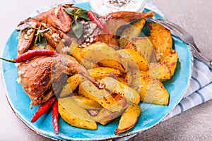 Roasted quails with potatoes