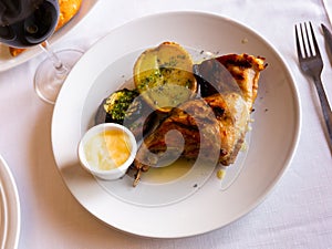 Roasted rabbit leg with grilled potato, eggplant, onion and aioli sauce