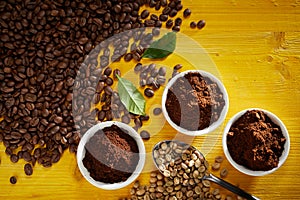 Roasted and raw coffee beans with grounds