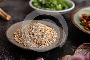 Roasted rice in a brown plate. Selective focus