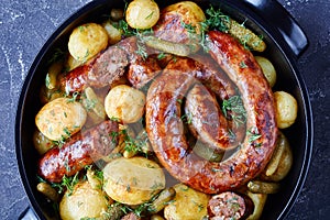 Roasted ring sausage, young potato and gherkins