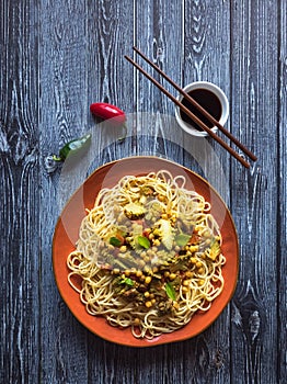 Roasted romanesco curry with nuts and pasta.