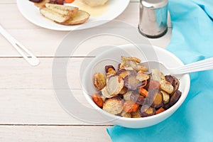 Roasted root vegetables: carrots, parsnips, sliced