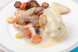 Roasted root vegetables: carrots, parsnips, sliced