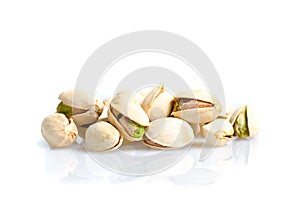 Roasted and salted pistachio nuts with shell with reflexion on w