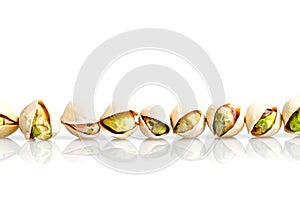 Roasted and salted pistachio with shell in line and reflexion is