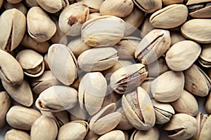 Roasted and salted pistachios in shell texture, background