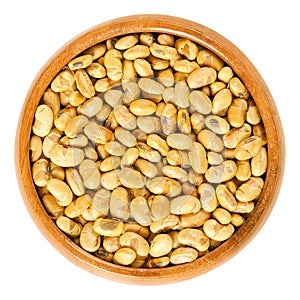 Roasted and salted soybeans in wooden bowl