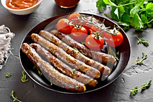 Roasted sausages and cherry tomatoes