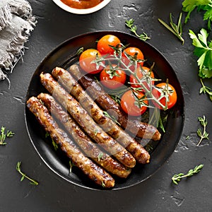 Roasted sausages and cherry tomatoes