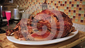 Roasted Thanksgiving Turkey Dish With Knife During Dinner Celebrating Holiday At Home. Wide shot