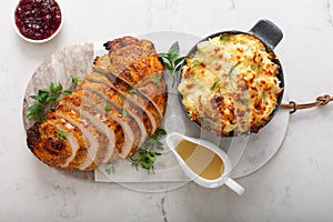 Roasted turkey breast sliced on a plate for holidays